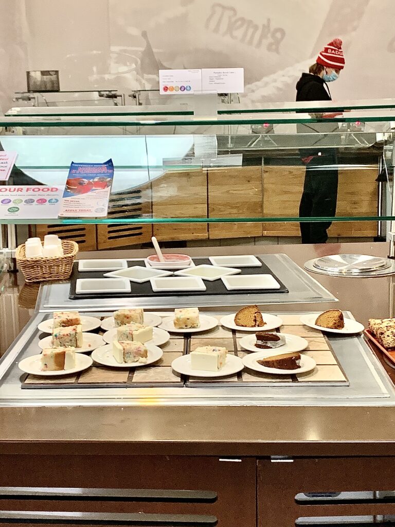 The lunchtime menu at the buffet-style dessert venue inside Gordon Avenue Market. Located on the tile serving display are rainbow confetti cake and pumpkin Bundt cake.